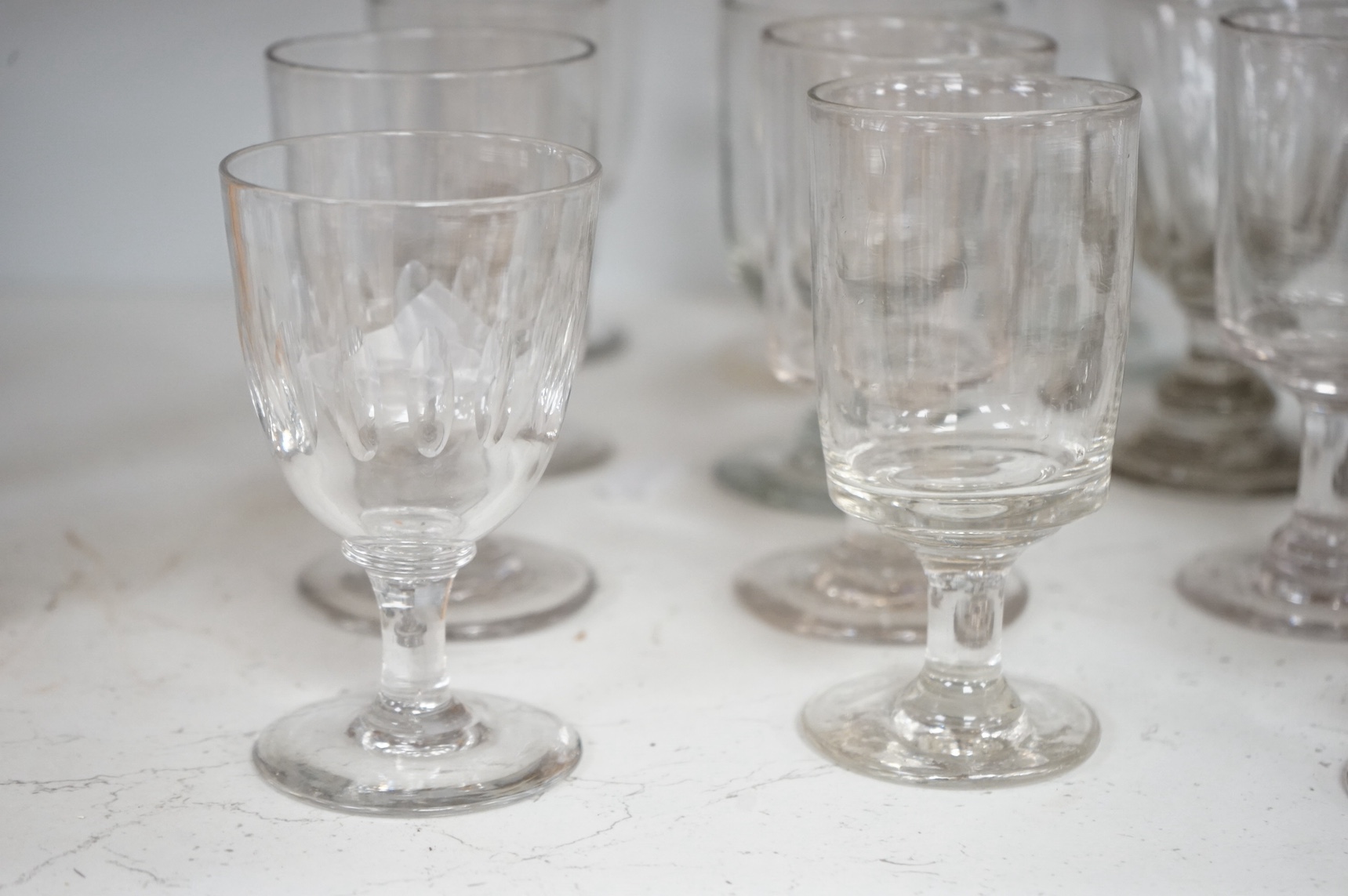 Sixteen George III and Victorian rummers and sherry glasses, largest 14cm high. Condition - mostly good